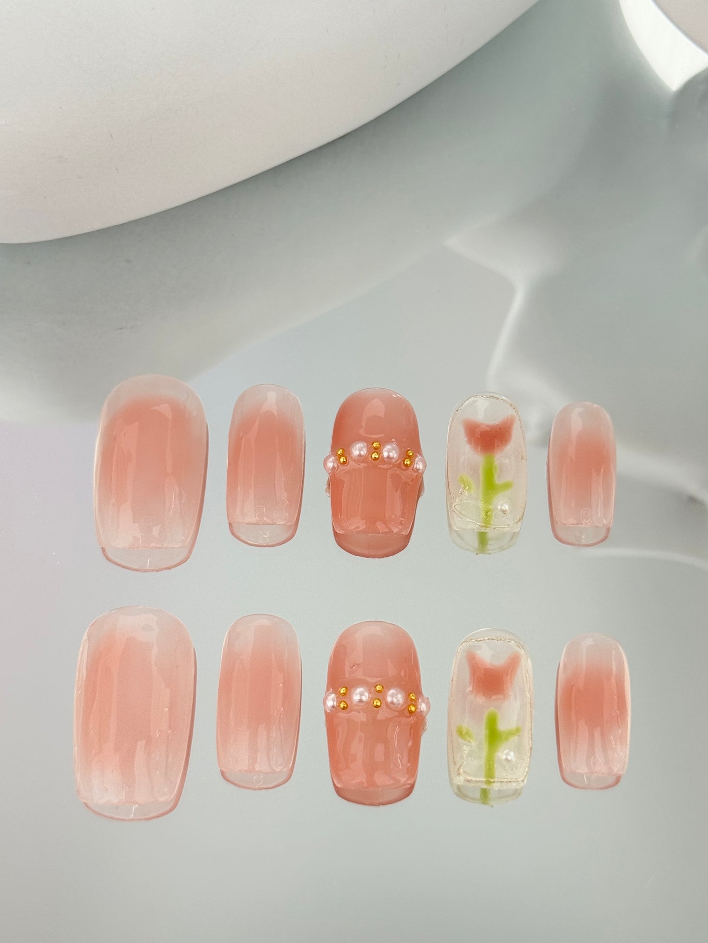 Medium length square oval hand painted tulip nails pink