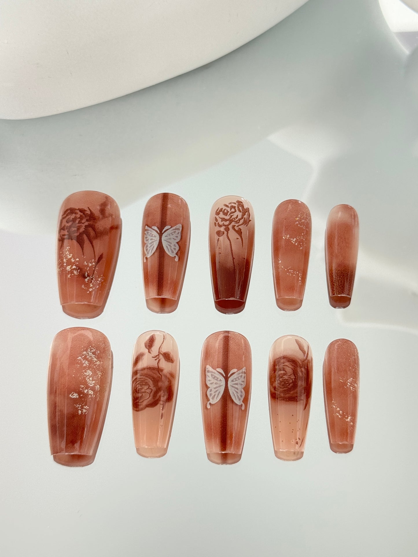 Long coffin butterfly nails brown