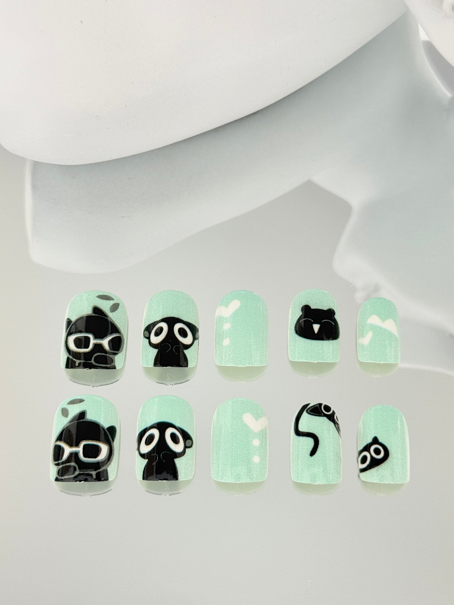 Short square oval black cat nails green