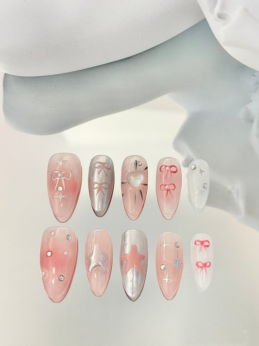 Long almond hand-painted nails pink