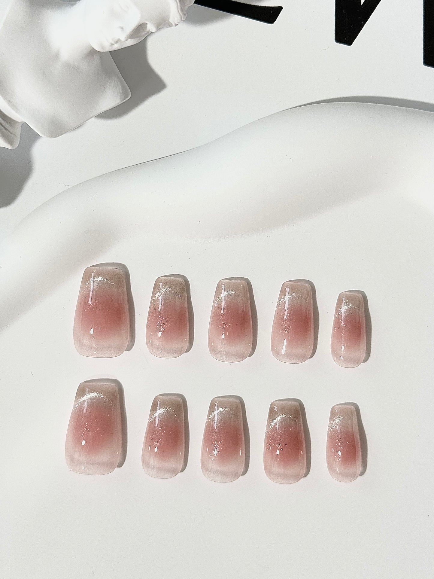 Medium length coffin cat eye blush nails pink