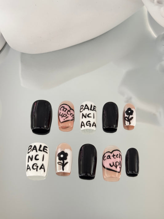 Medium length coffin hand painted nails black pink