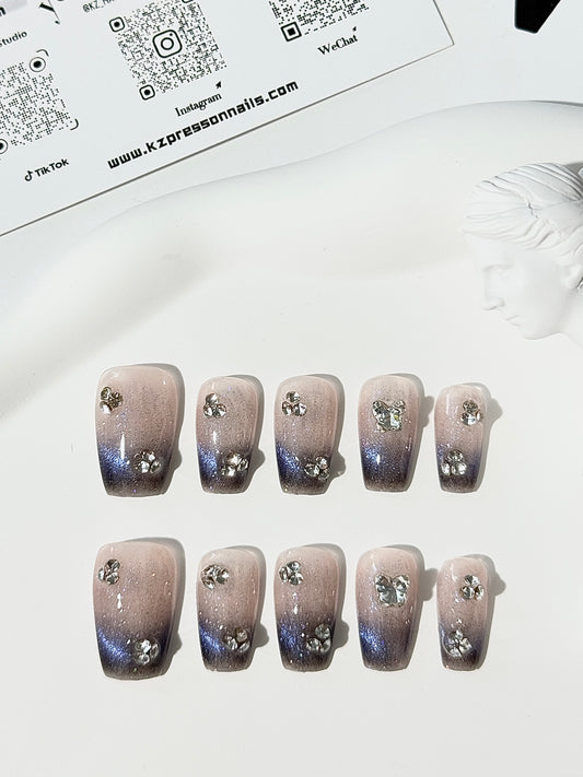 Medium length coffin cat eye diamond nails blue